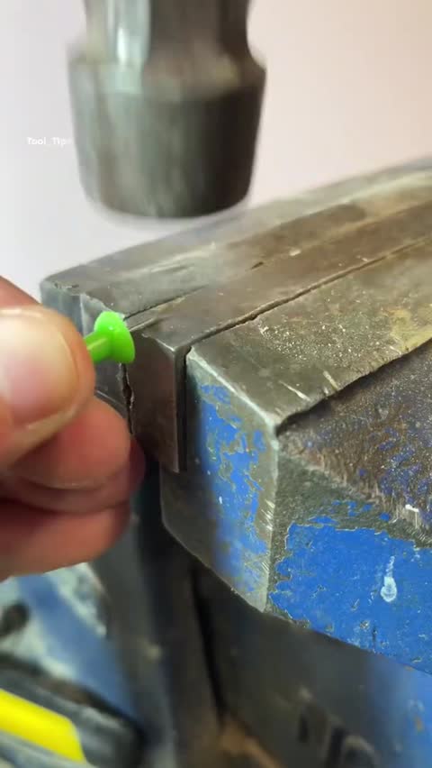 Hands Using a Precision Screwdriver on a Small Electronic Device