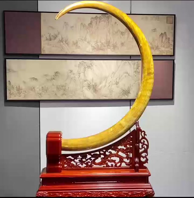 Mammoth ivory pendulum with gold-plated original tusk